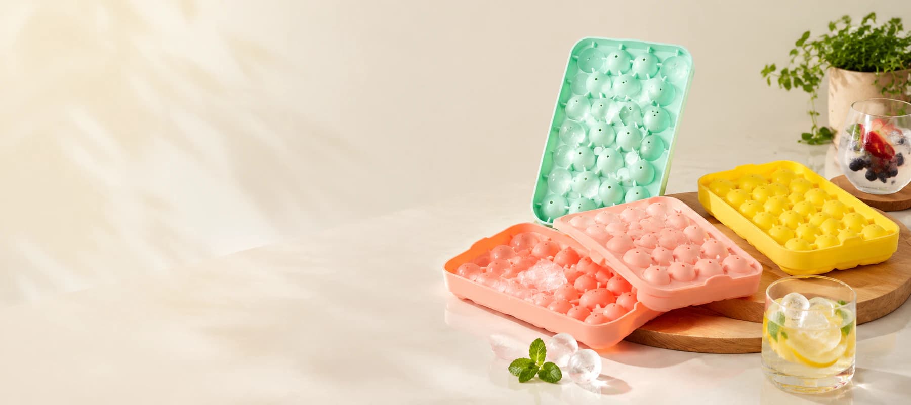 Four Obsoorth ice tray models in a warm kitchen setting