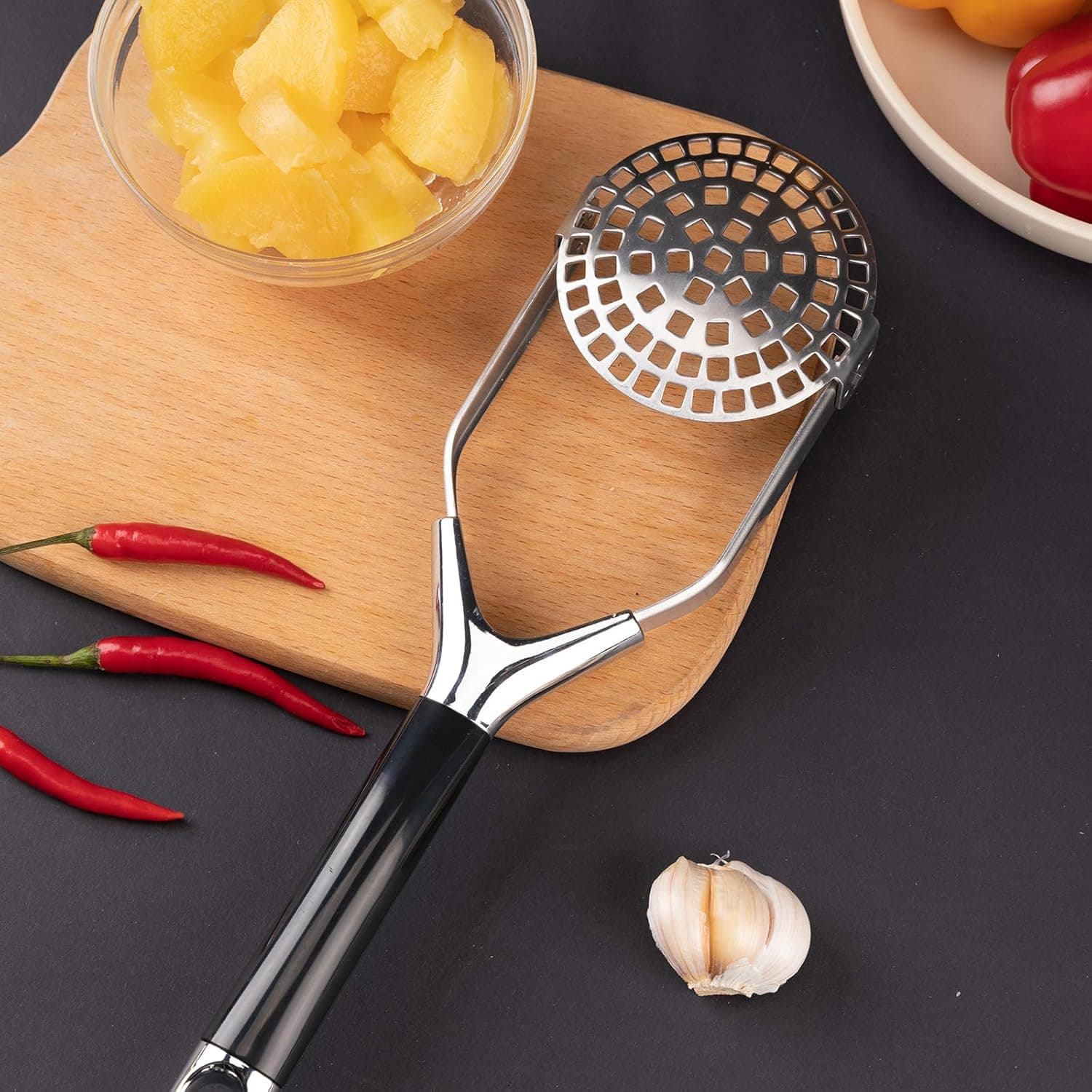 Top view of the Obsoorth foldable stainless steel potato masher