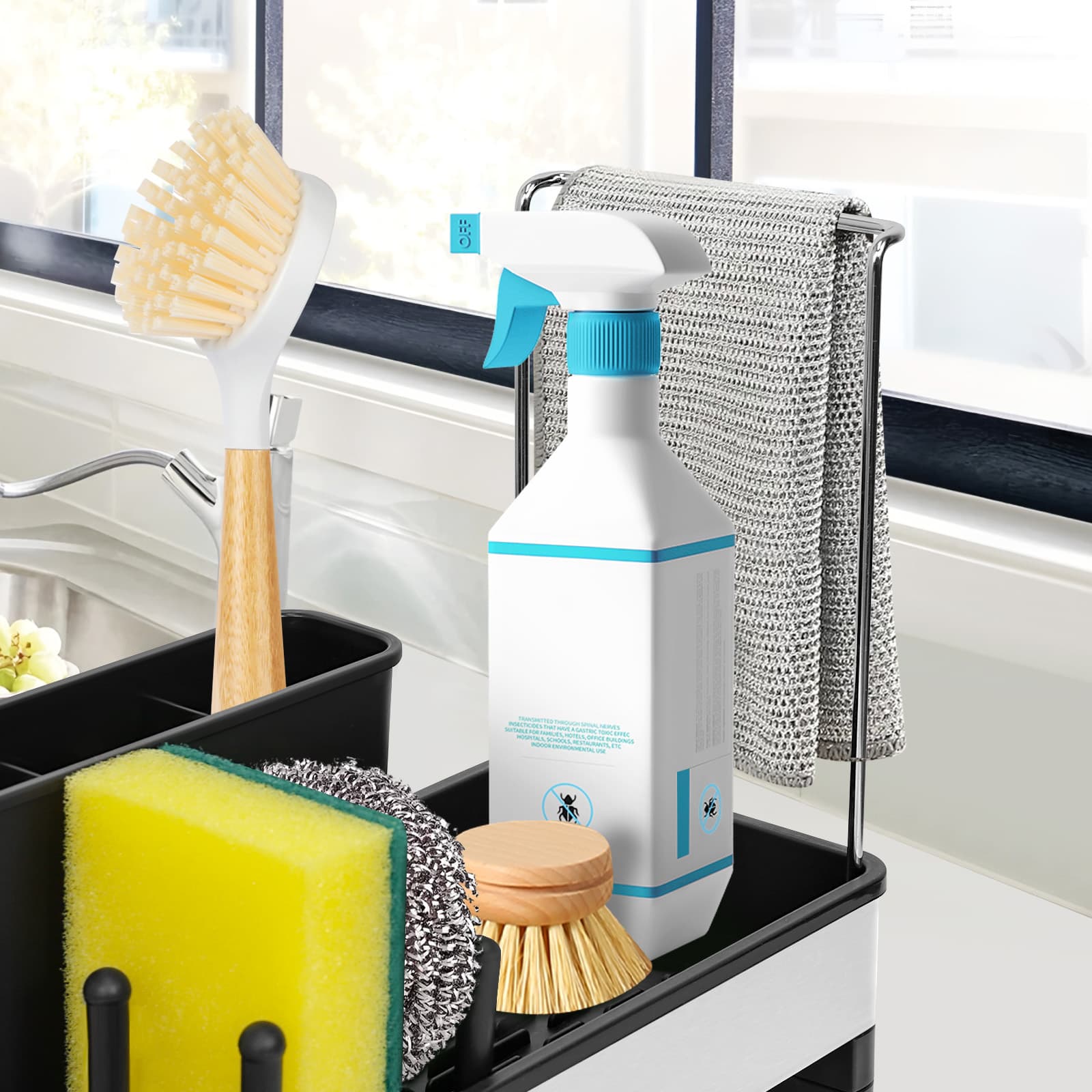 Obsoorth black sink caddy holding kitchen cleaning tools beside a sink